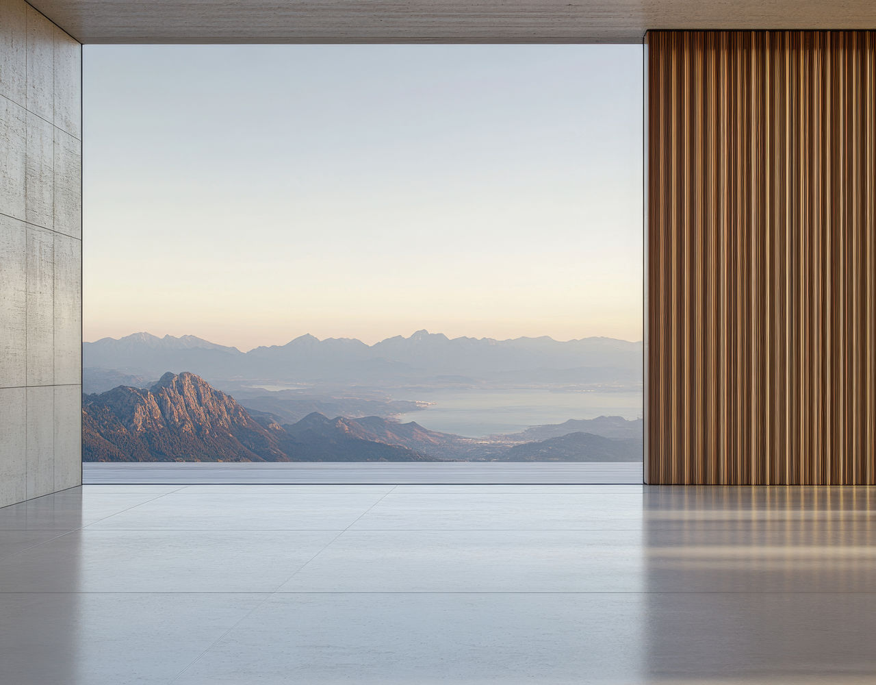 Minimalist interior with panoramic mountain view, reflecting the clarity and focus of minimal microsites in creative branding featured in Art+Media+Design Journal.