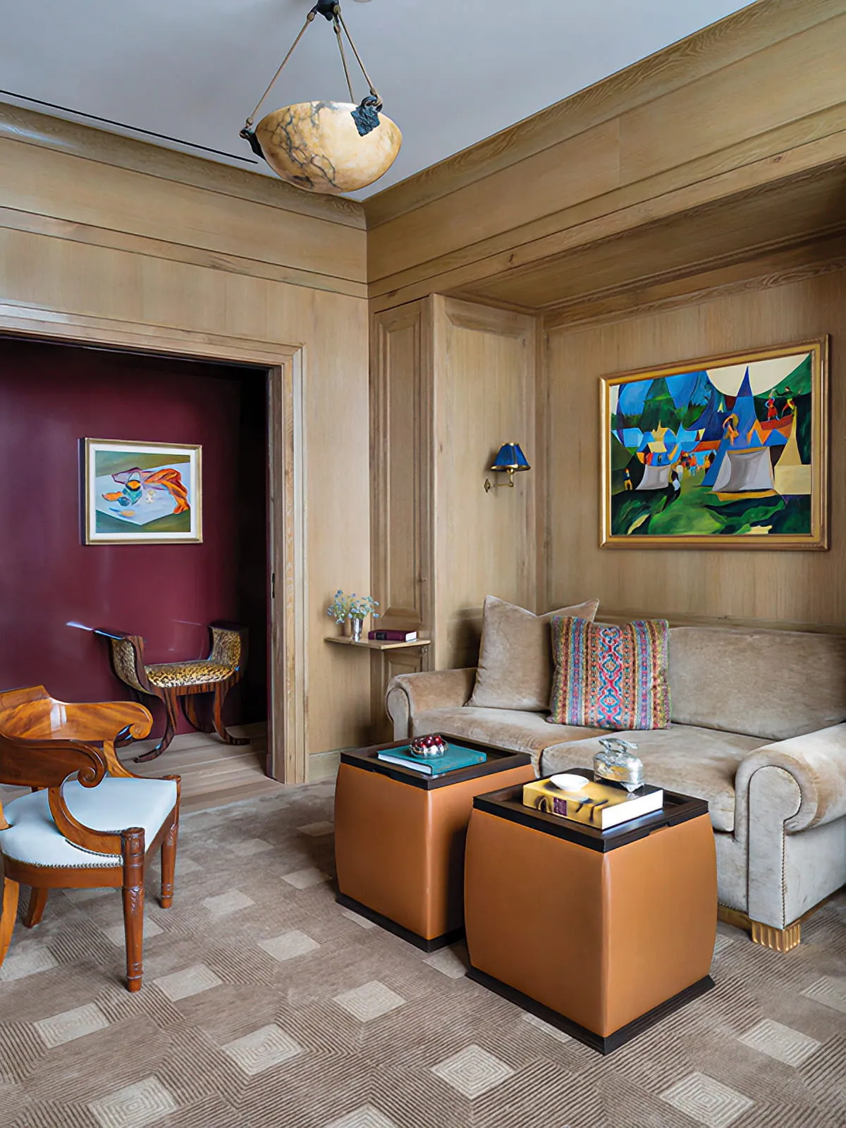 Wood-paneled sitting room with built-in seating, leather ottomans, artwork, and a burgundy doorway.